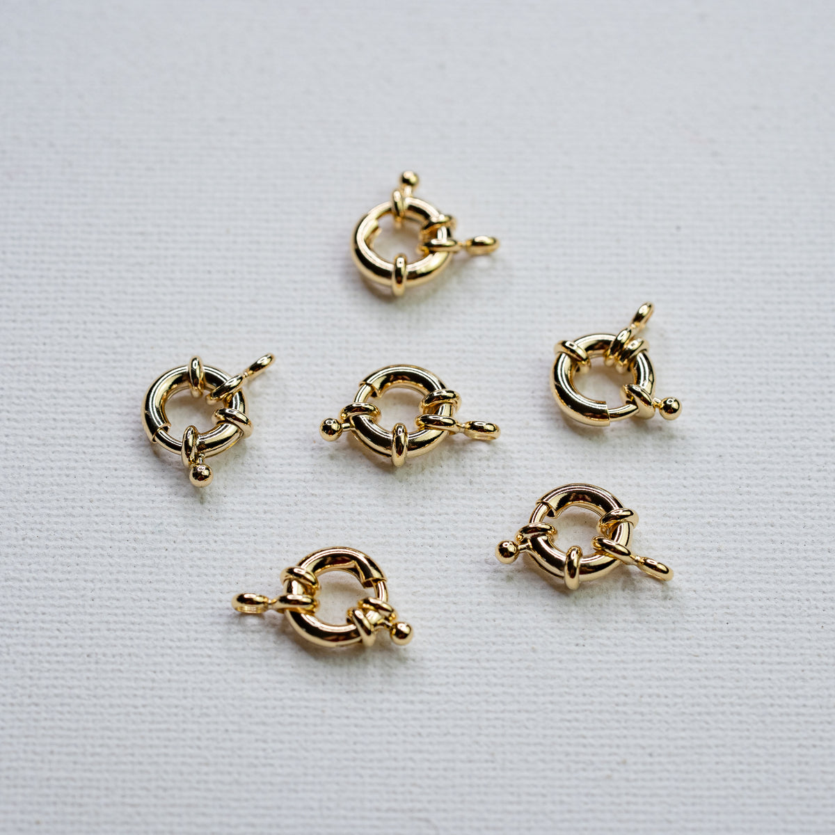 Fermoirs roue en laiton plaqué or 18k de 11 x 2,5 mm ( à l&