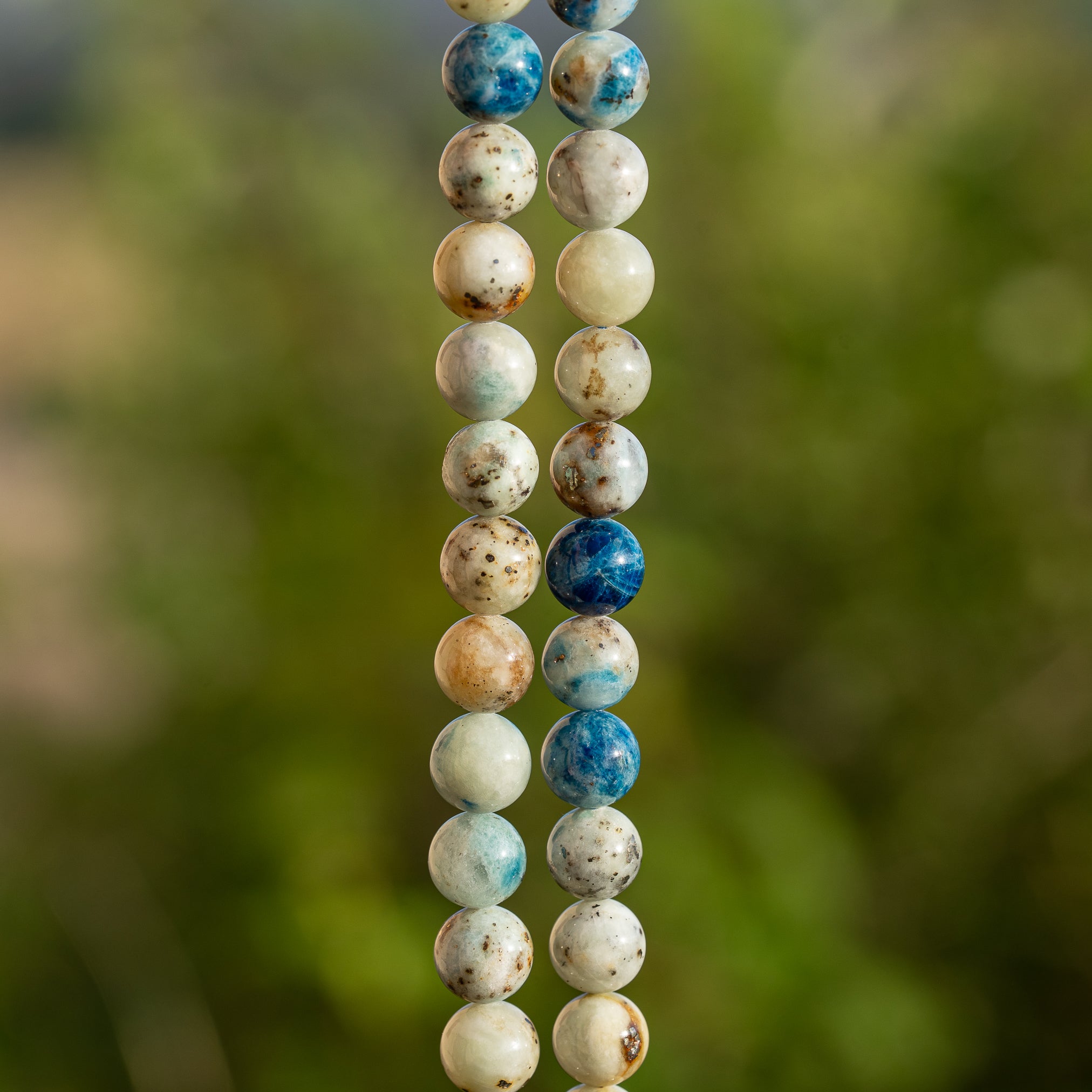 Perles rondes lisses de Calcite à inclusions d&