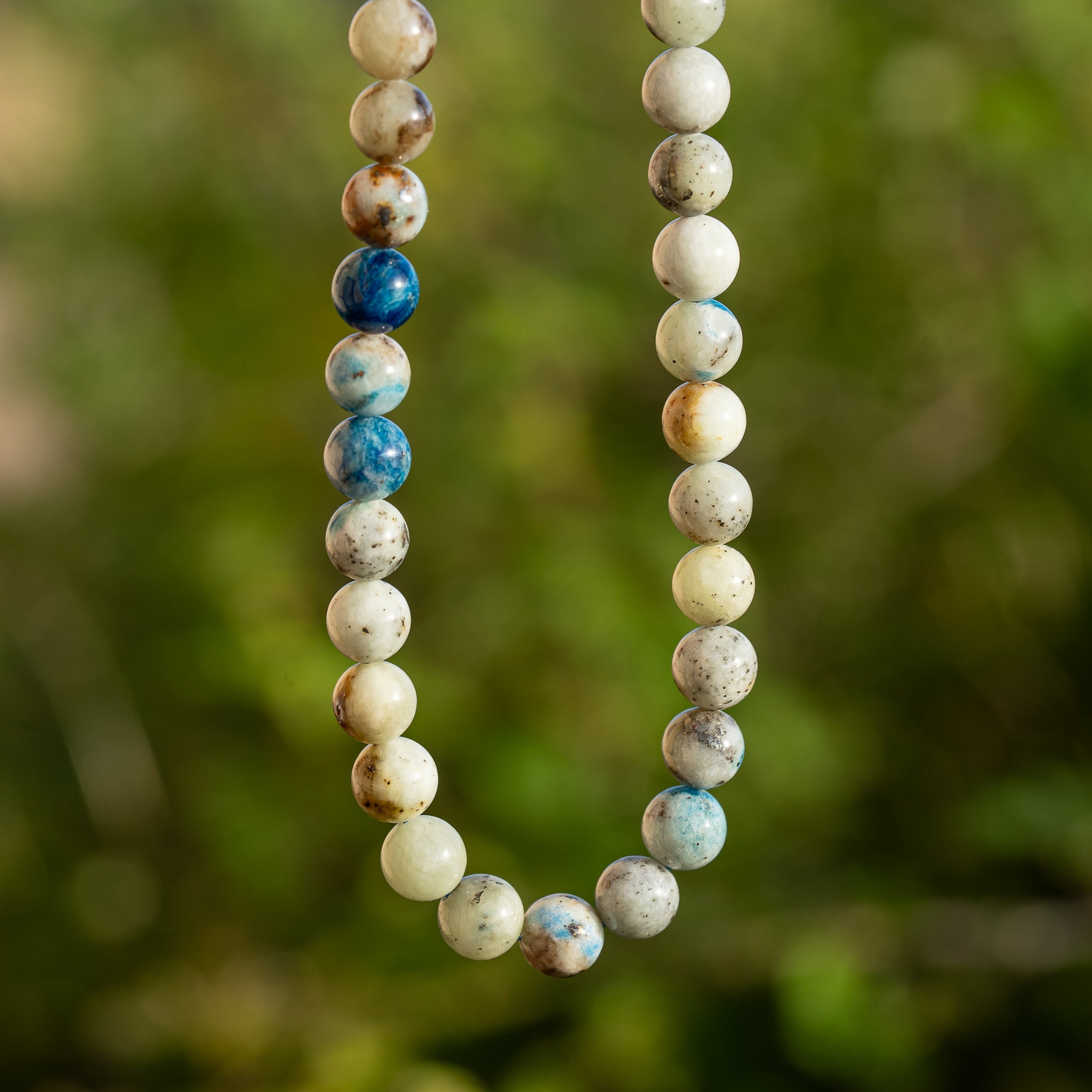 Perles rondes lisses de Calcite à inclusions d&