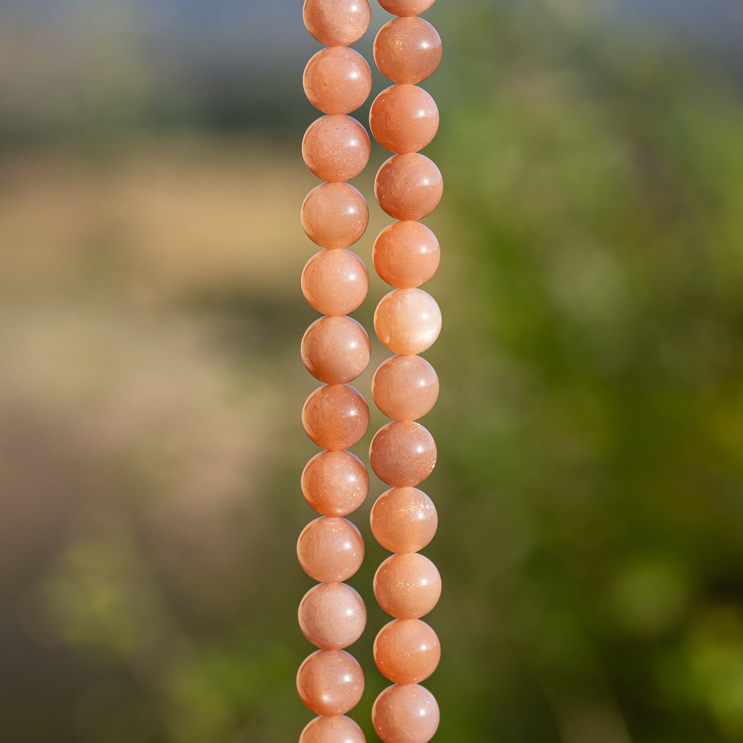 Perles rondes lisses de pierre de lune rose solaire grade A de 8,5 mm ( 1/2 rang de env 23 perles )