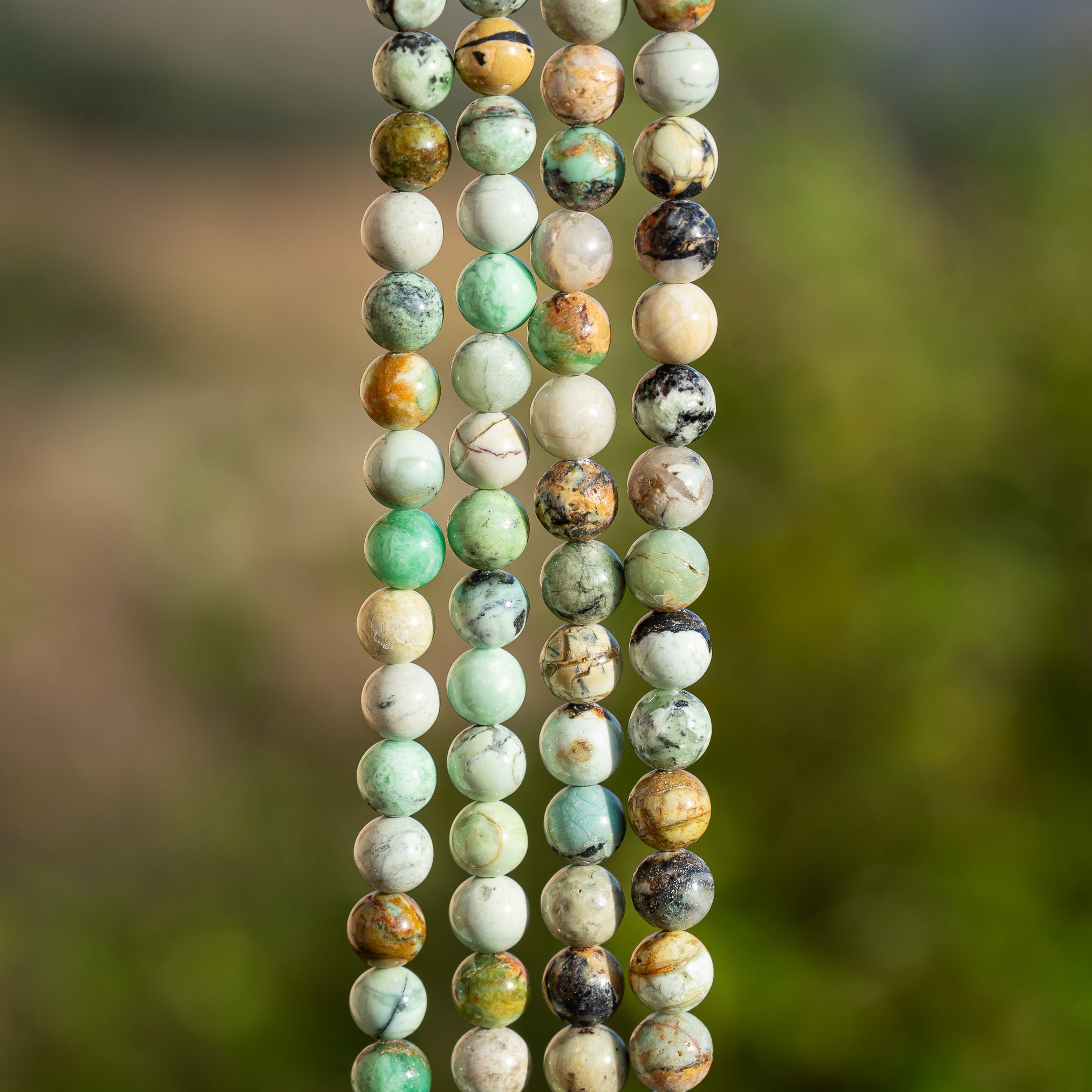 Perles rondes lisses de Variscite de 6 ou 6,5 mm ( 1/2 rang de 32/30 perles )