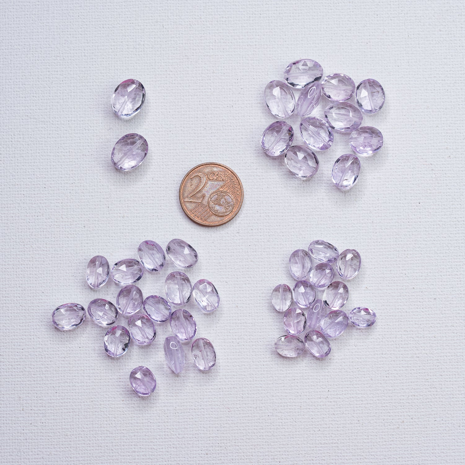 Perles ovales facettes en Améthyste lilas de env 7,5 à 11,5 mm ( à l&