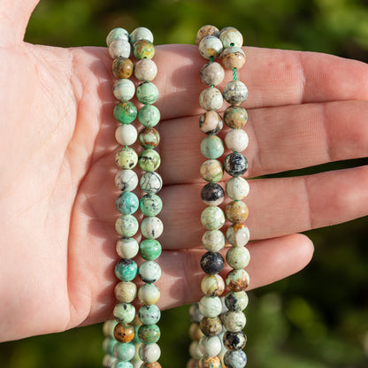 Perles rondes lisses de Variscite de 6,5 mm ( 1/2 rang de 30 perles )