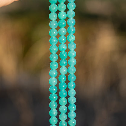 Perles rondes lisses en Amazonite du Pérou de 6,2 mm ( 1/2 rang de env 30 perles )