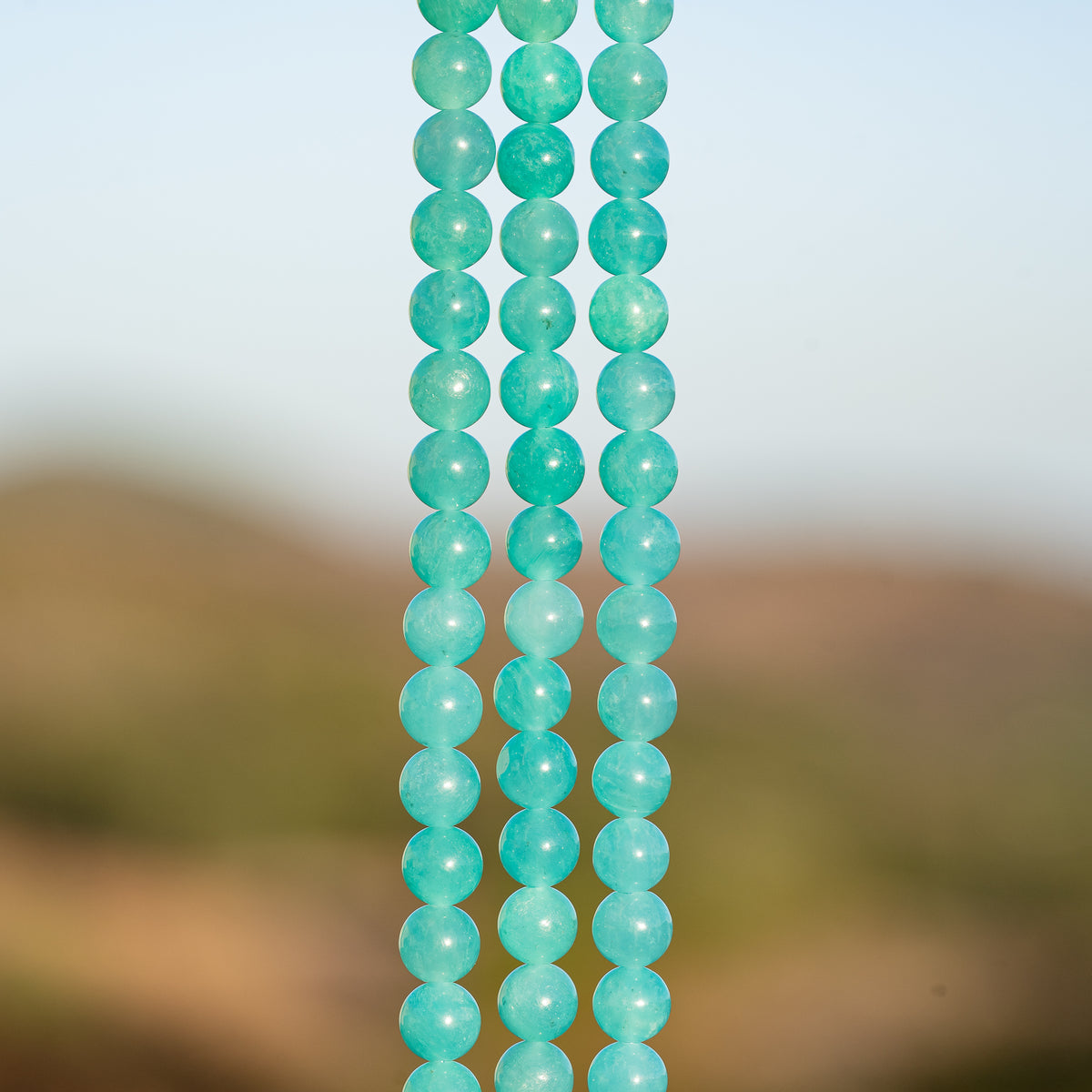 Perles rondes lisses en Amazonite du Pérou de 6,2 mm ( 1/2 rang de env 30 perles )