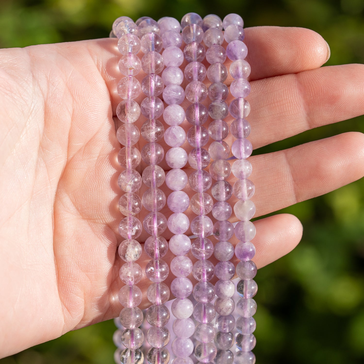 Perles rondes lisses en Améthyste lilas de 6/6,5 mm au choix ( rang de env 60/70 perles )