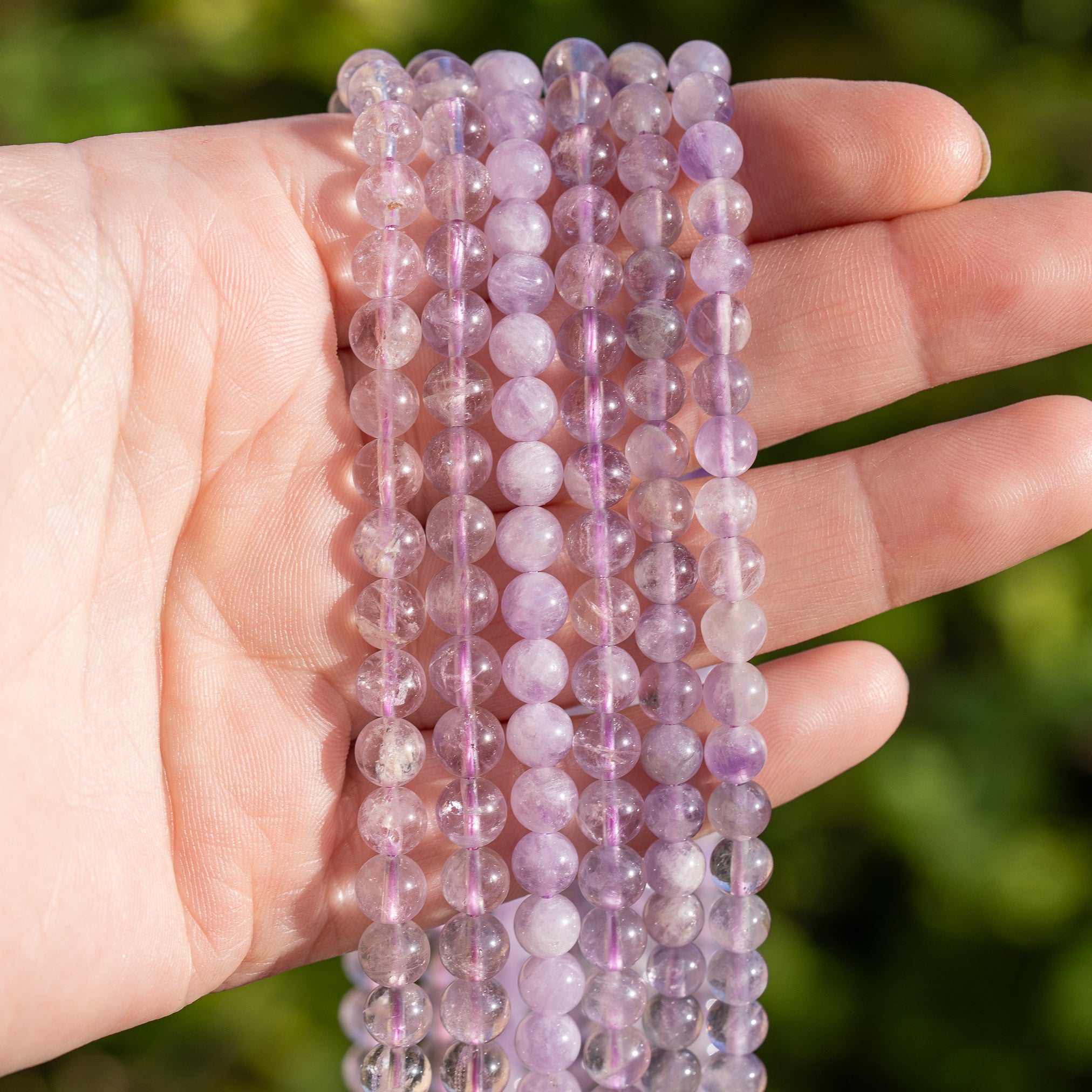 Perles rondes lisses en Améthyste lilas de 6/6,5 mm au choix ( rang de env 60/70 perles )