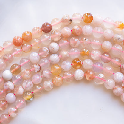 Perles rondes lisses en Agate fleur de cerisier de 8,5 mm ( rang de env 46 perles )