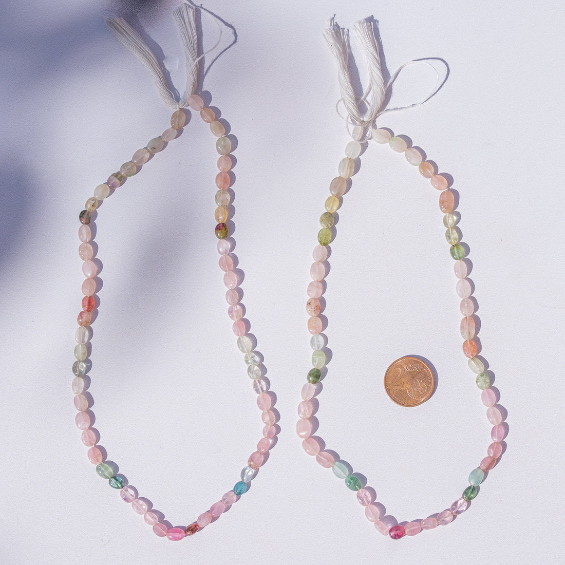 Fil de 34/36 cm de perles ovales plates lisses de Tourmaline pastel de 6/7 mm