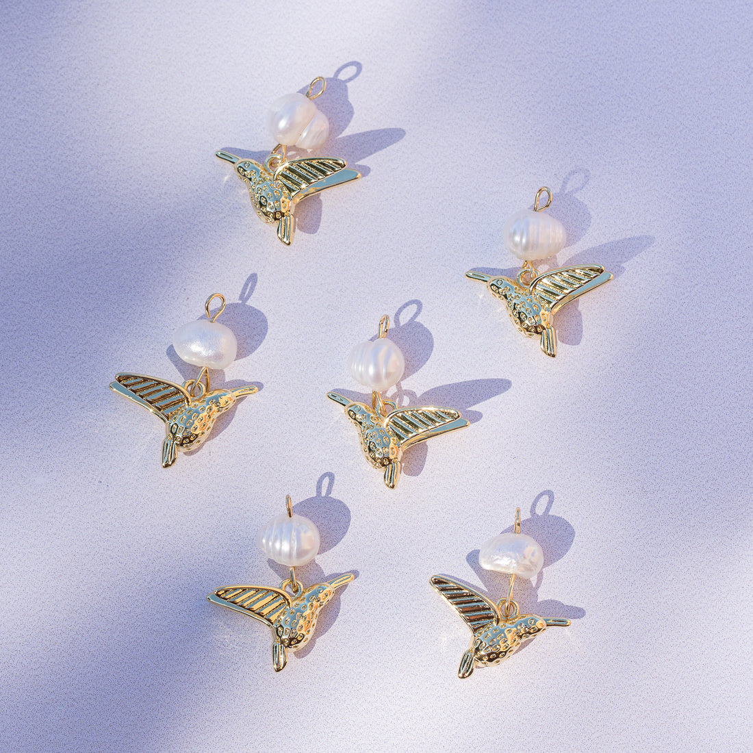 Breloques oiseaux en perle d&