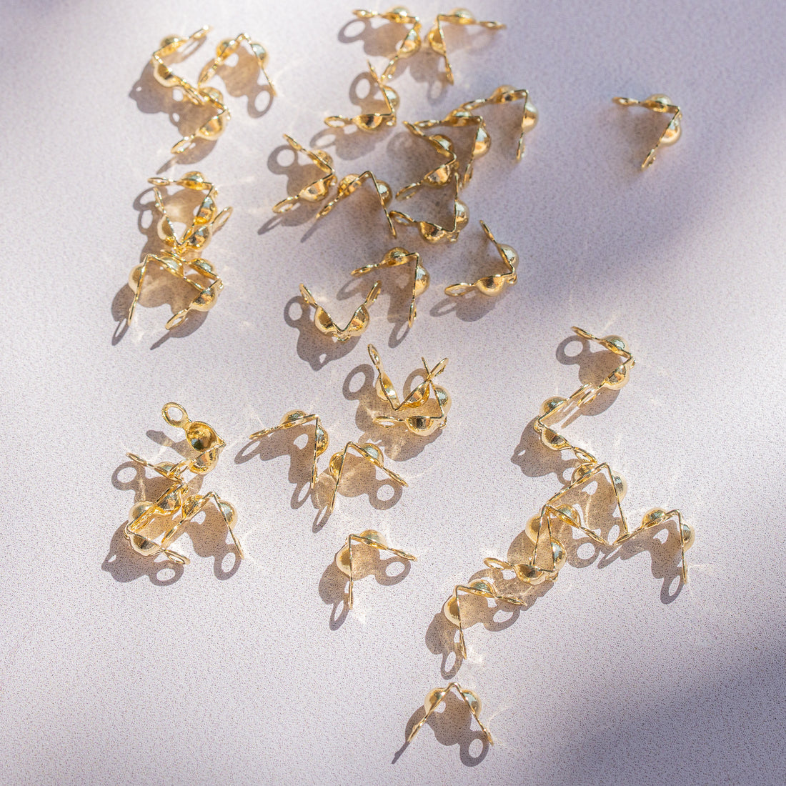 Caches noeuds en laiton plaqué or 18K de 6 x 3,5 mm ( vendus par 4 )