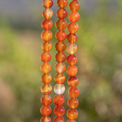 Perles rondes lisses de Cornaline de 8 mm ( rang de env 48 perles )