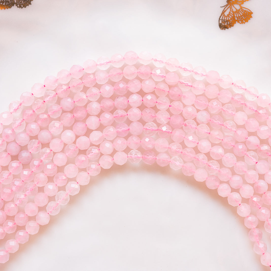 Perles rondes facettes de Quartz rose de 6 mm ( rang de env 60 perles )