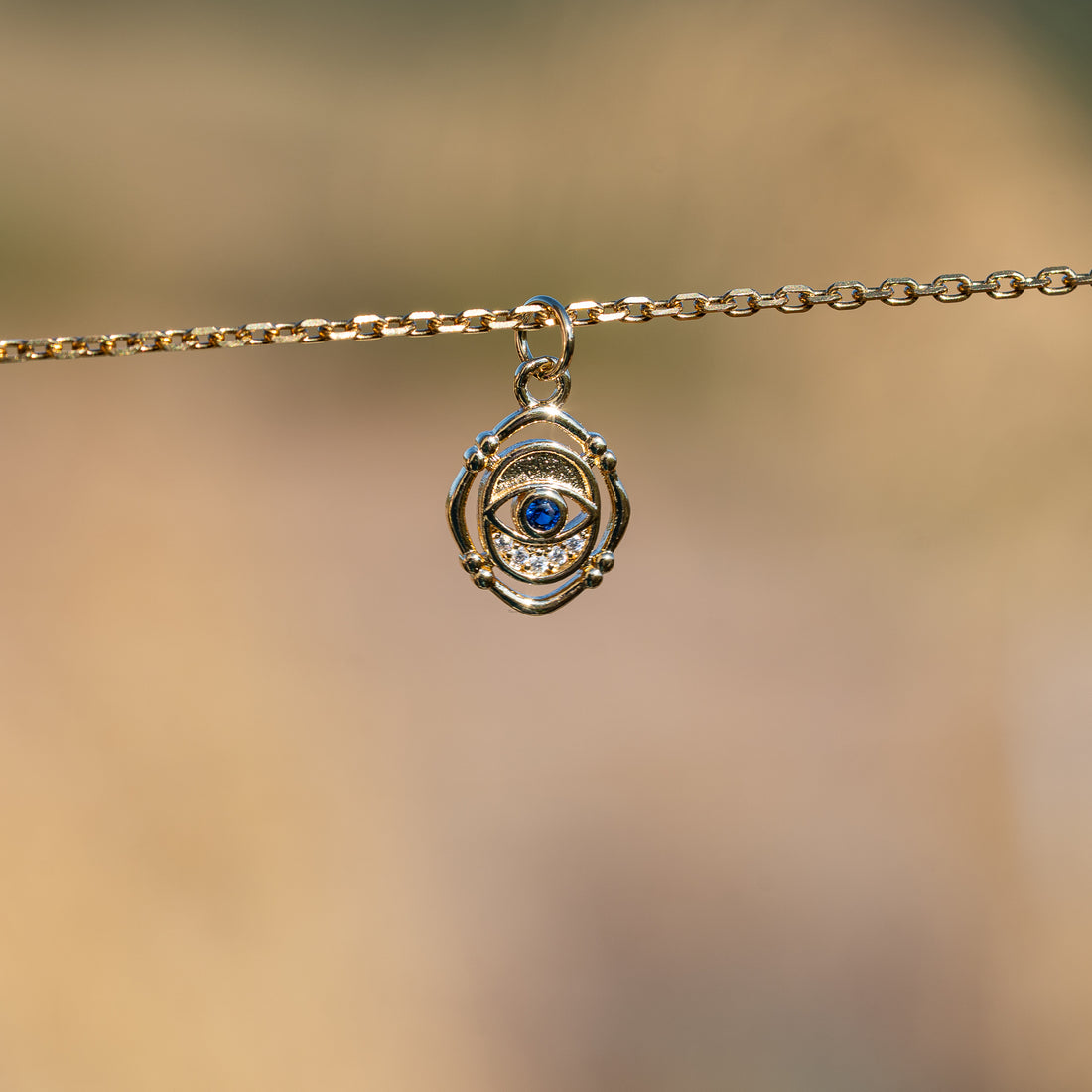 Breloques oeil en laiton plaqué or 18k et zirconium de 15 mm ( à l&