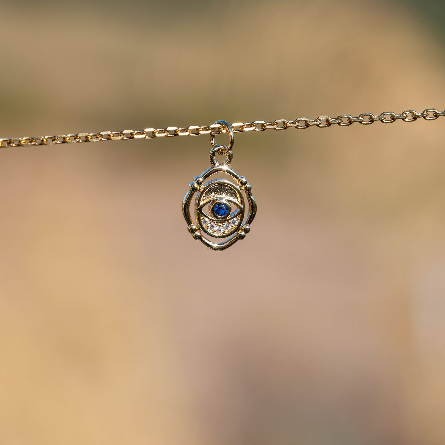 Breloques oeil en laiton plaqué or 18k et zirconium de 15 mm ( à l&