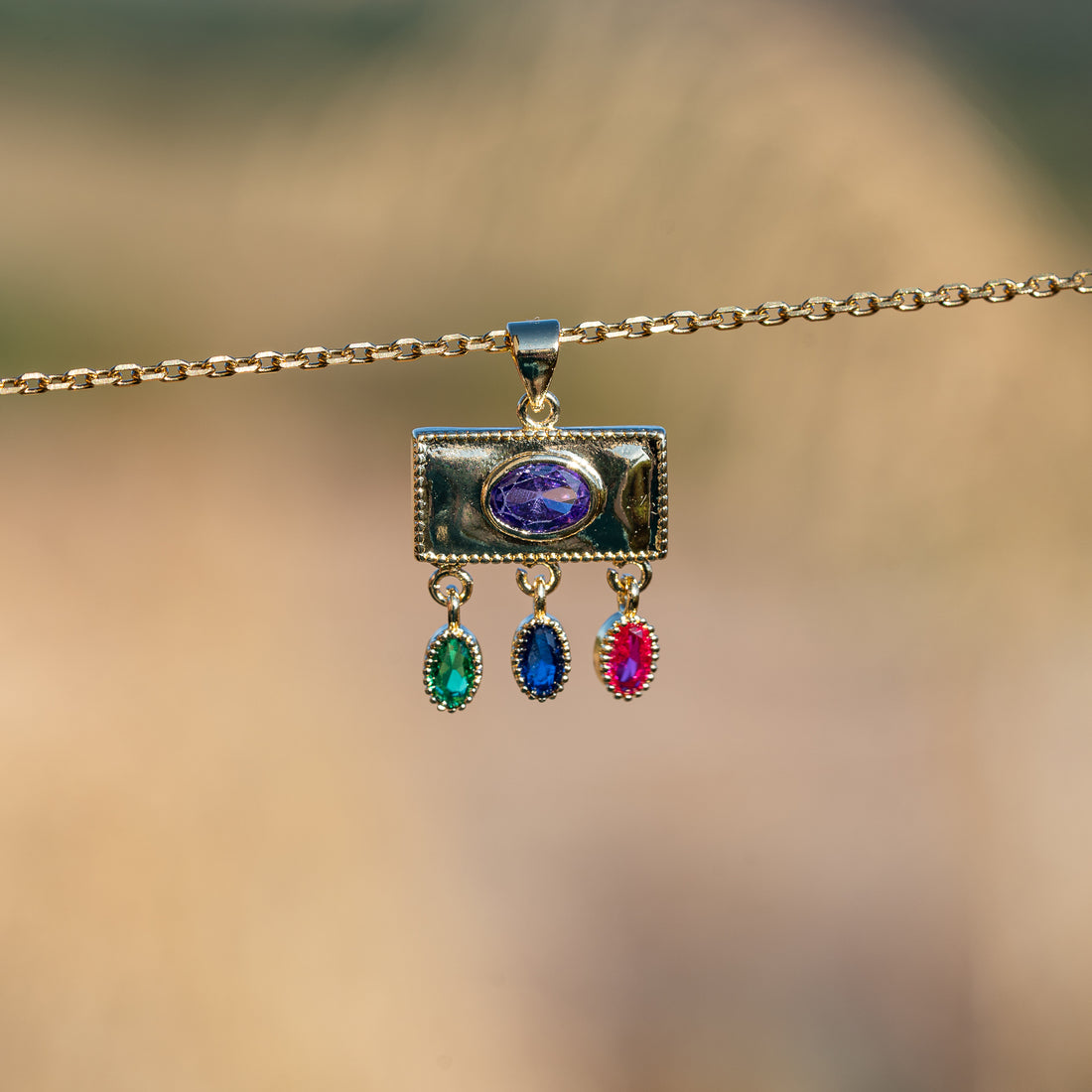 Breloques rectangle/oeil en laiton plaqué or 18k et zirconium colorés de 22 mm ( à l&