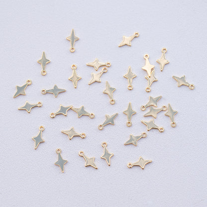 Petites breloques étoiles en laiton plaqué or 18k de 10,5 mm ( lot de 2 ou par 10 )