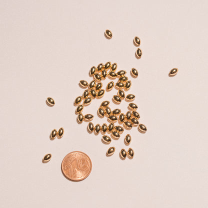 Perles ovoïdes en laiton plaqué or 18k de 6 x 4 mm ( lot de 4 ou 10  )