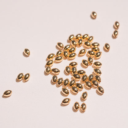 Perles ovoïdes en laiton plaqué or 18k de 6 x 4 mm ( lot de 4 ou 10  )