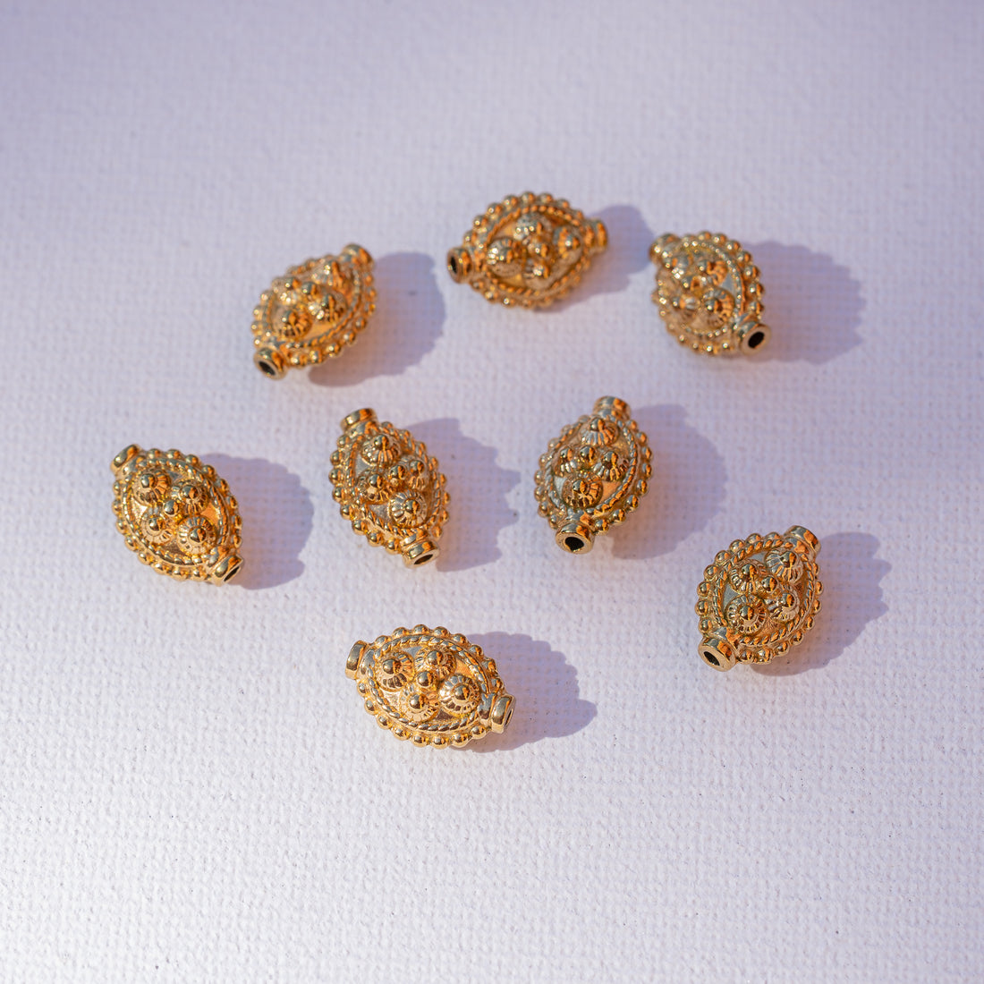 Perles ovales travaillées en acier inoxydable plaqué or de 14 x 10 x 7 mm ( à l&