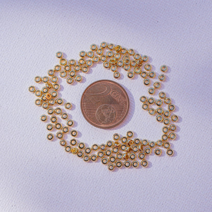 Perles rondelles plates lisses en laiton plaqué or 18k de 3 x 1,5 mm ( lot de 10 )
