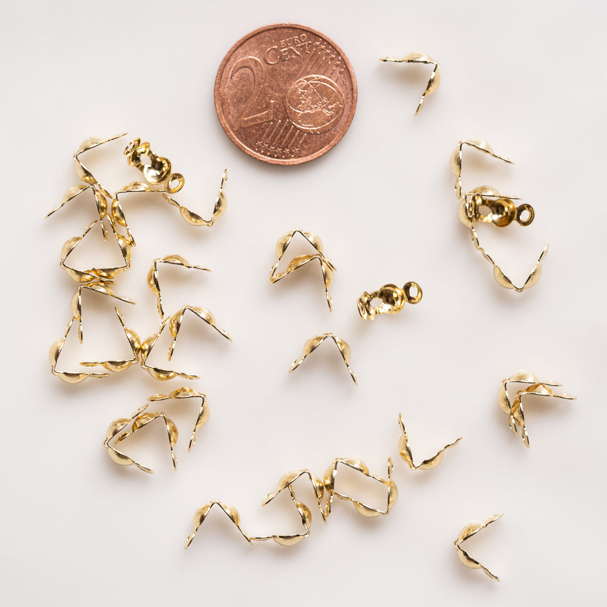 Caches noeuds en acier inoxydable plaqué or 18k  de 7,5 mm ( vendus par 4 )