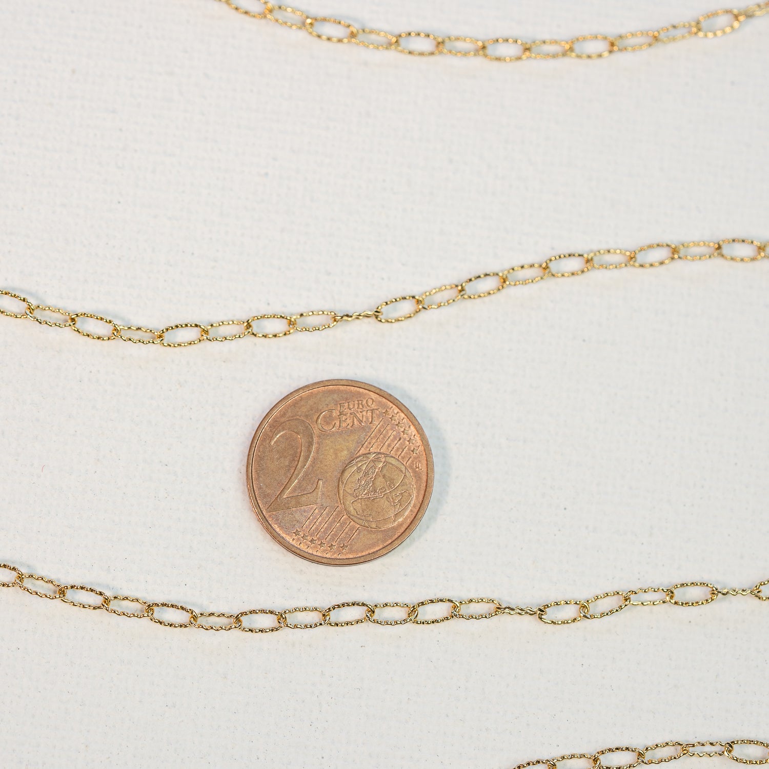 Chaine ovale texturée en acier inoxydable plaqué or 18k de 5,5 mm ( par 50 cm )