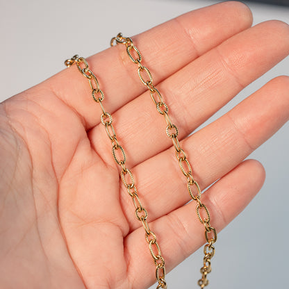 Chaine ovale texturée en acier inoxydable plaqué or 18k de 5/7 mm ( par 50 cm )