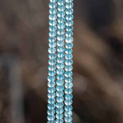 Perles rondelles facettes de Topaze bleue de 6 x 4 mm ( 1/4 rang de env 23 perles )