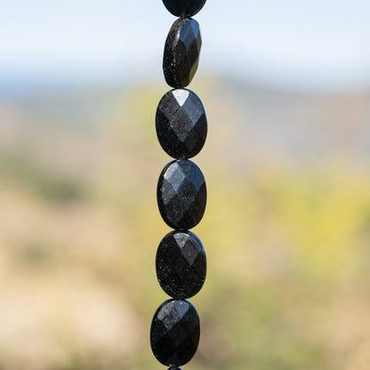 Perles ovales facettes en Obsidienne noire de env 18 mm ( à l&