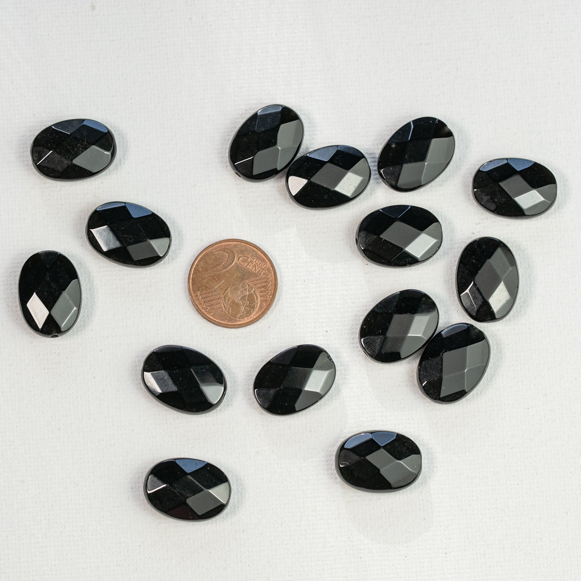 Perles ovales facettes en Obsidienne noire de env 18 mm ( à l&