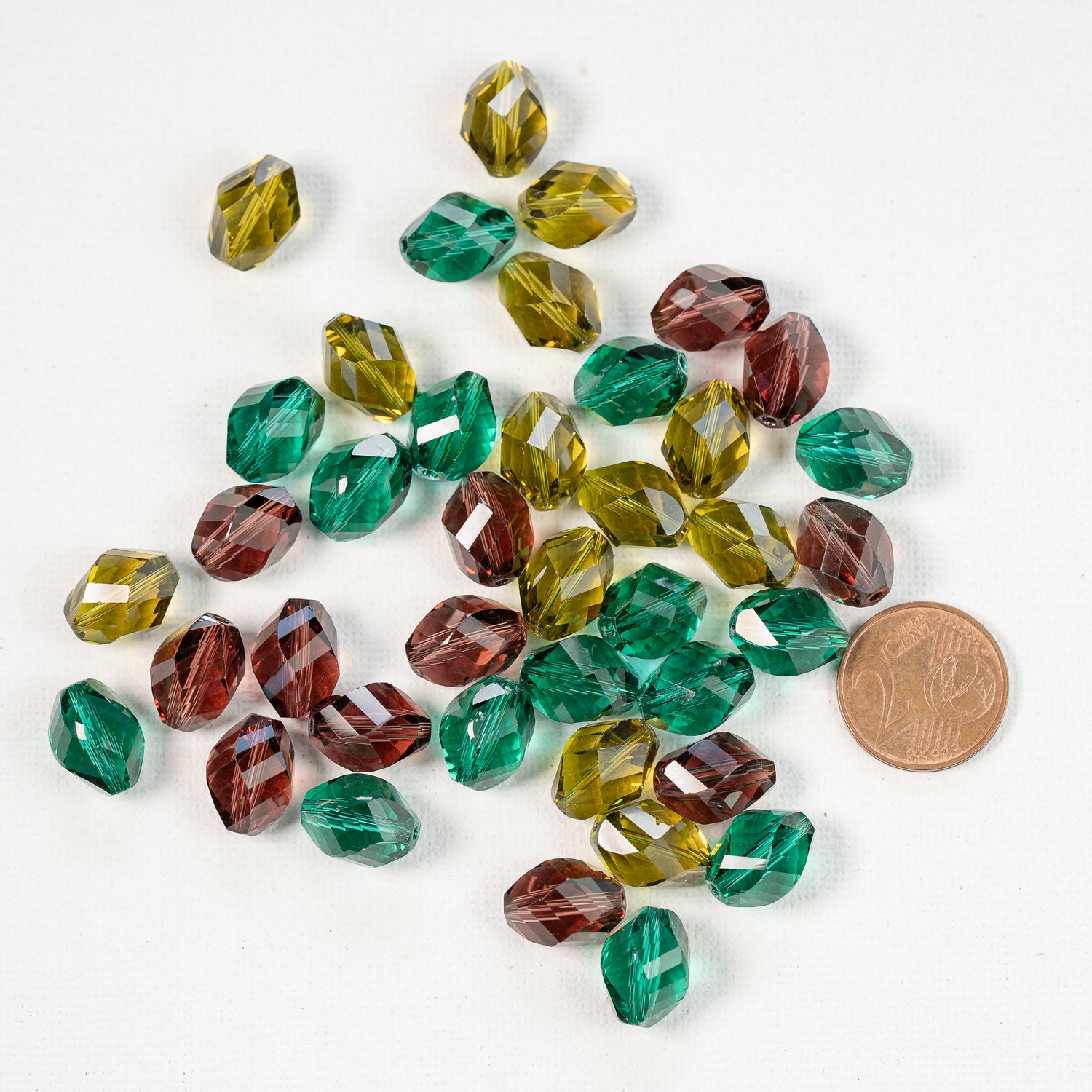 Perles ovales torsadées facettes en verre K9 de 13 x 10 mm couleurs au choix ( lot de 2 )