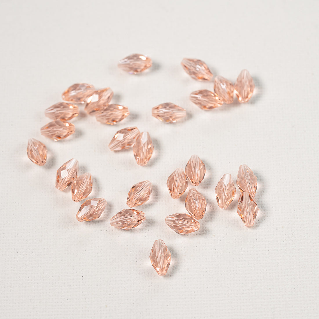 Perles ovales facettes en verre K9 rose saumon de 9,5 x 5,5 mm ( lot de 2 )