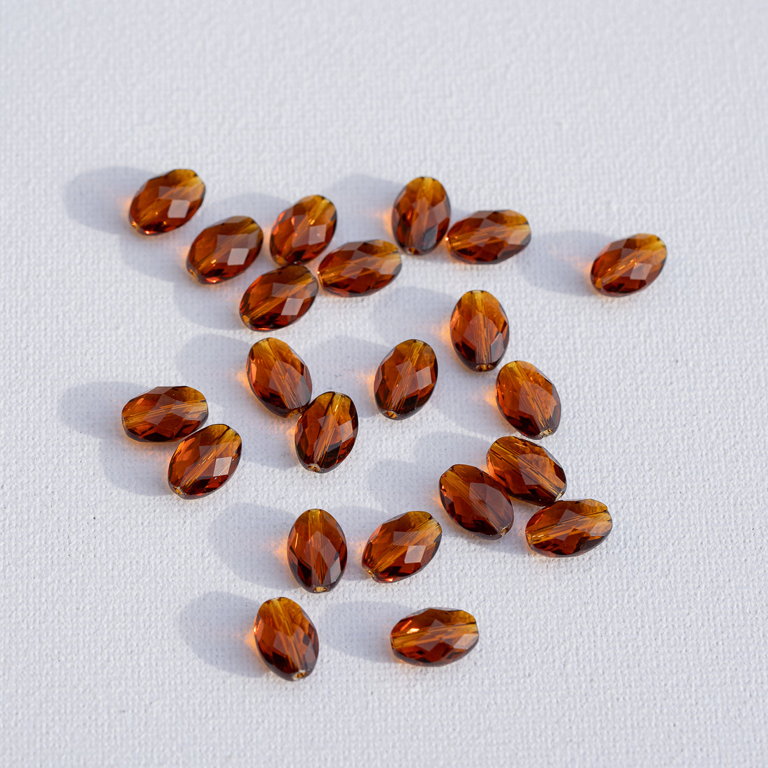 Perles ovales facettes en verre K9 cognac de 11,5 x 6 mm ( lot de 2 )