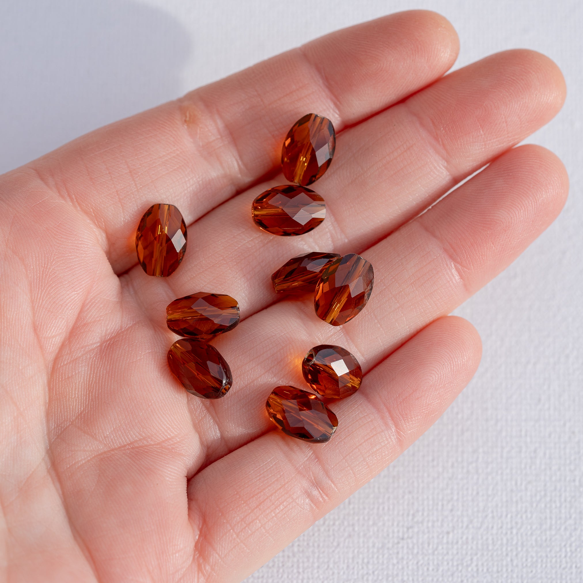 Perles ovales facettes en verre K9 cognac de 11,5 x 6 mm ( lot de 2 )