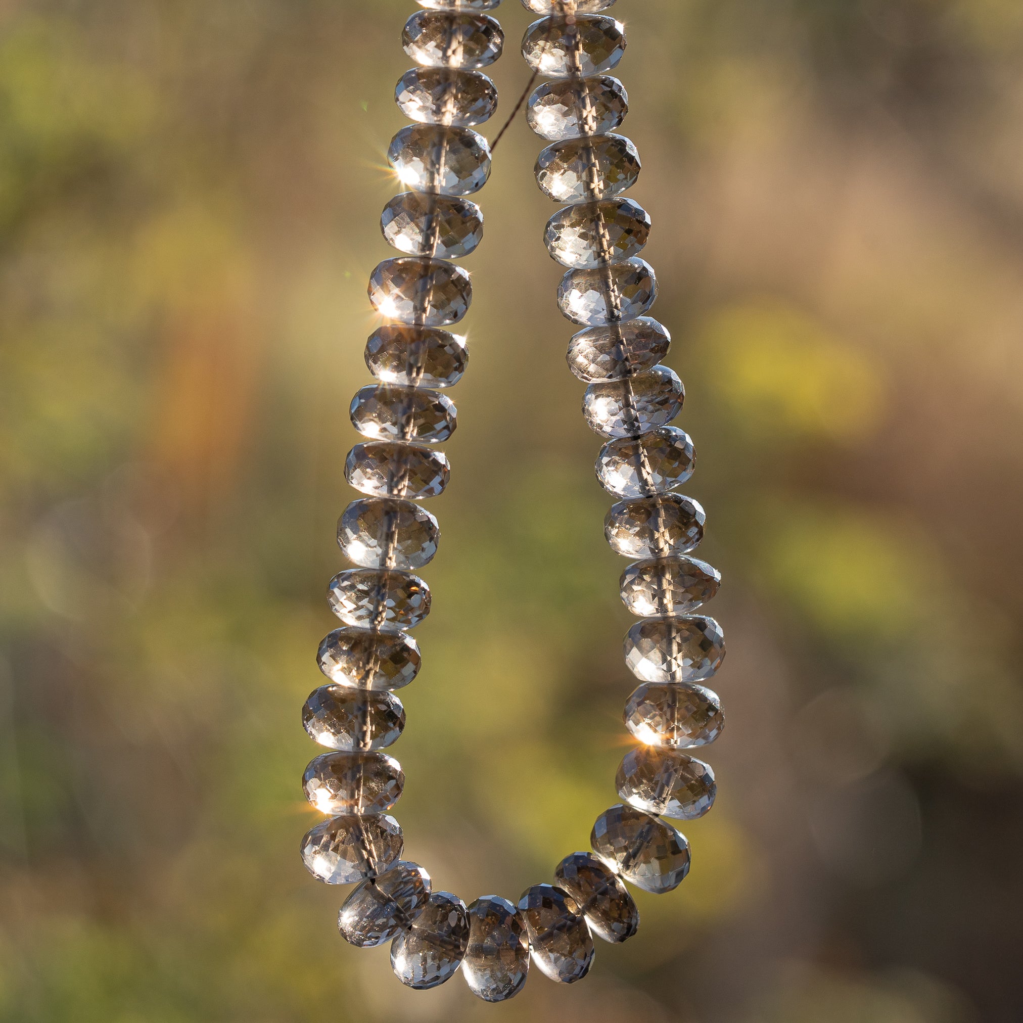 Perles rondelles facettes de quartz fumé de env 7 ou 9 mm ( lot de 2 perles )