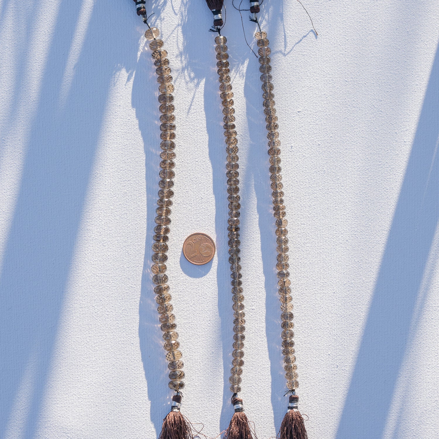 Fil de env 20 cm de perles rondelles facettes de quartz fumé de env 7,5 ou 9,5 mm