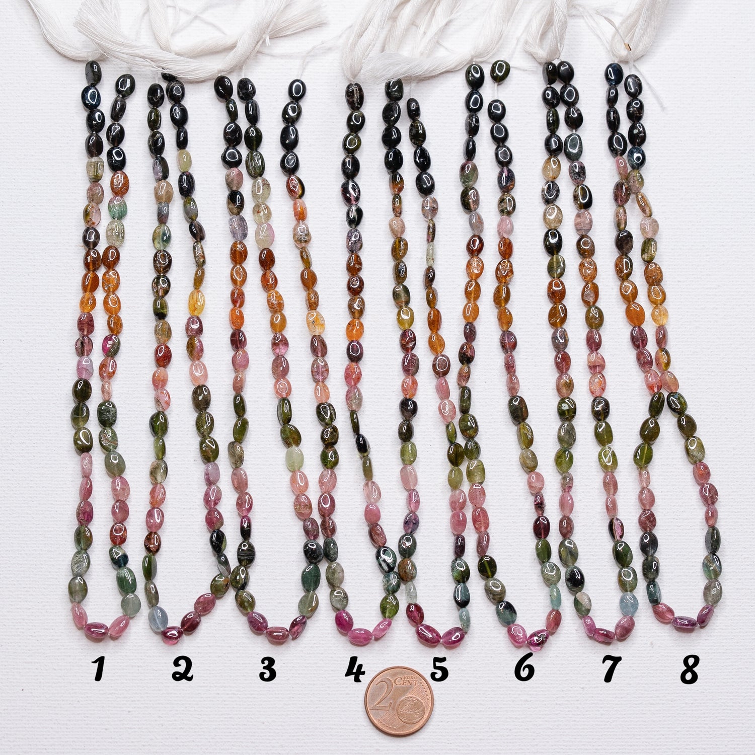 Rangs de 32 cm de perles ovales lisses de Tourmaline multicolore de env 5,5/7,5 mm